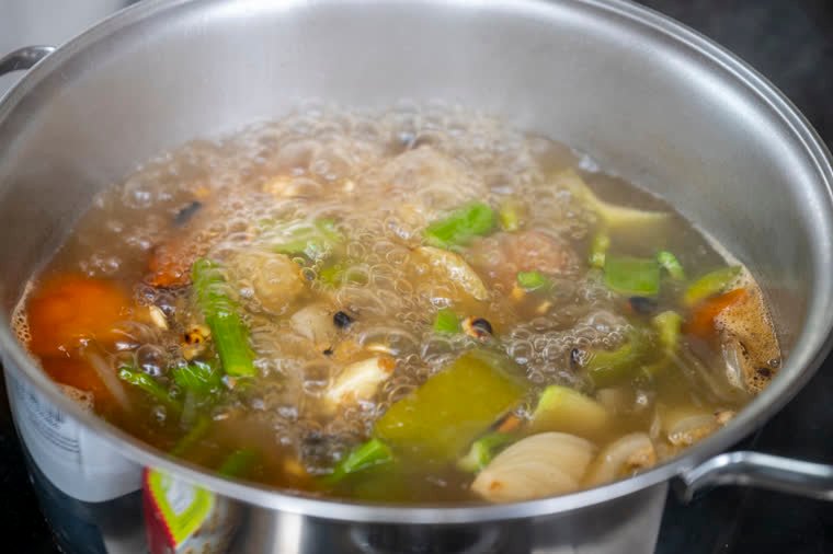 Vegetable broth at a full boil.