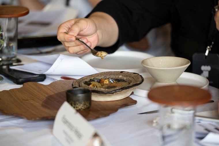 A spoonful mid-tasting on the evaluation table.